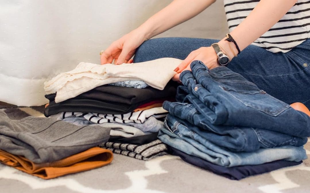 woman decluttering clothes_1500x1000